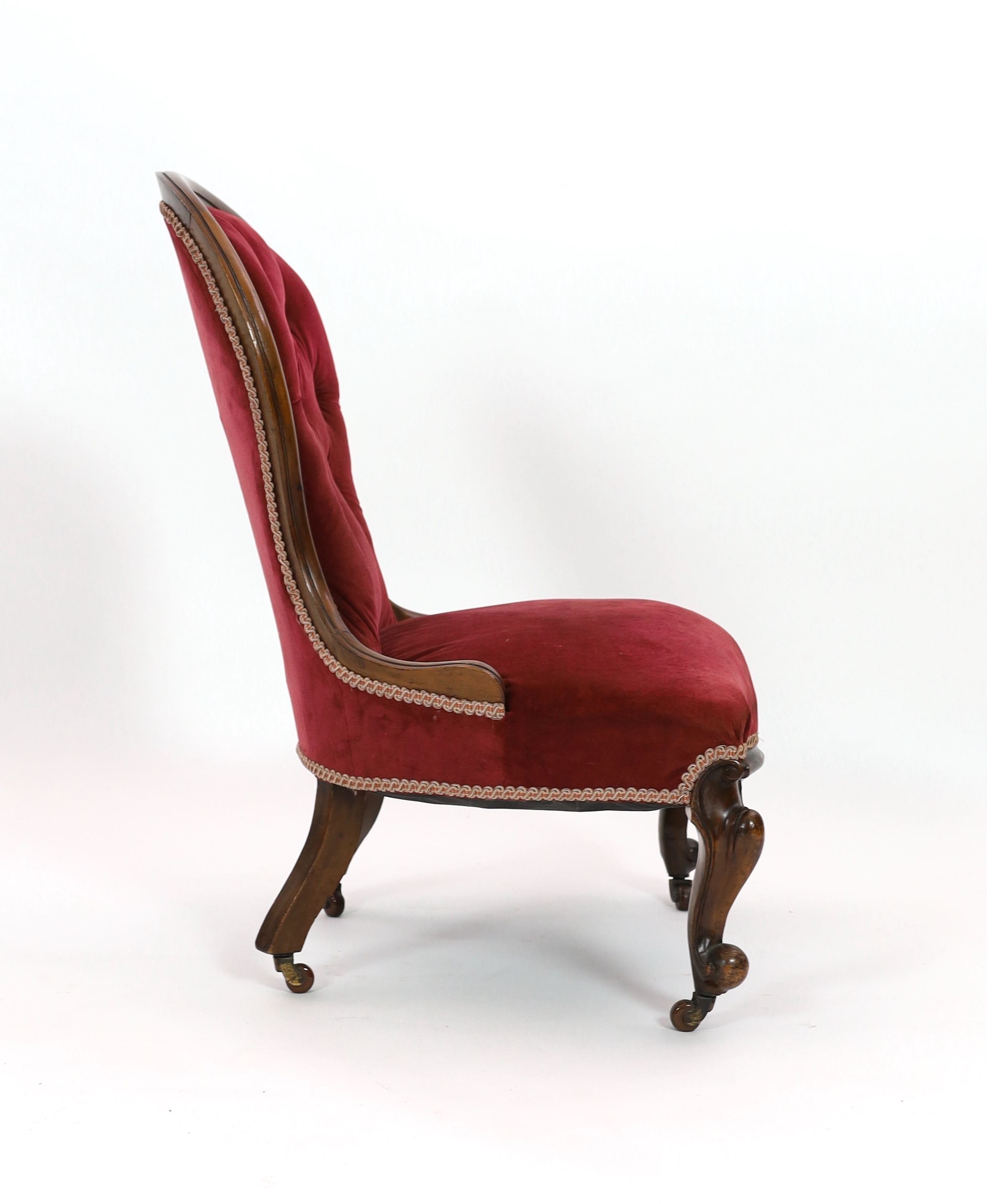 A Victorian walnut spoonback nursing chair, width 60cm depth 54cm height 92cm